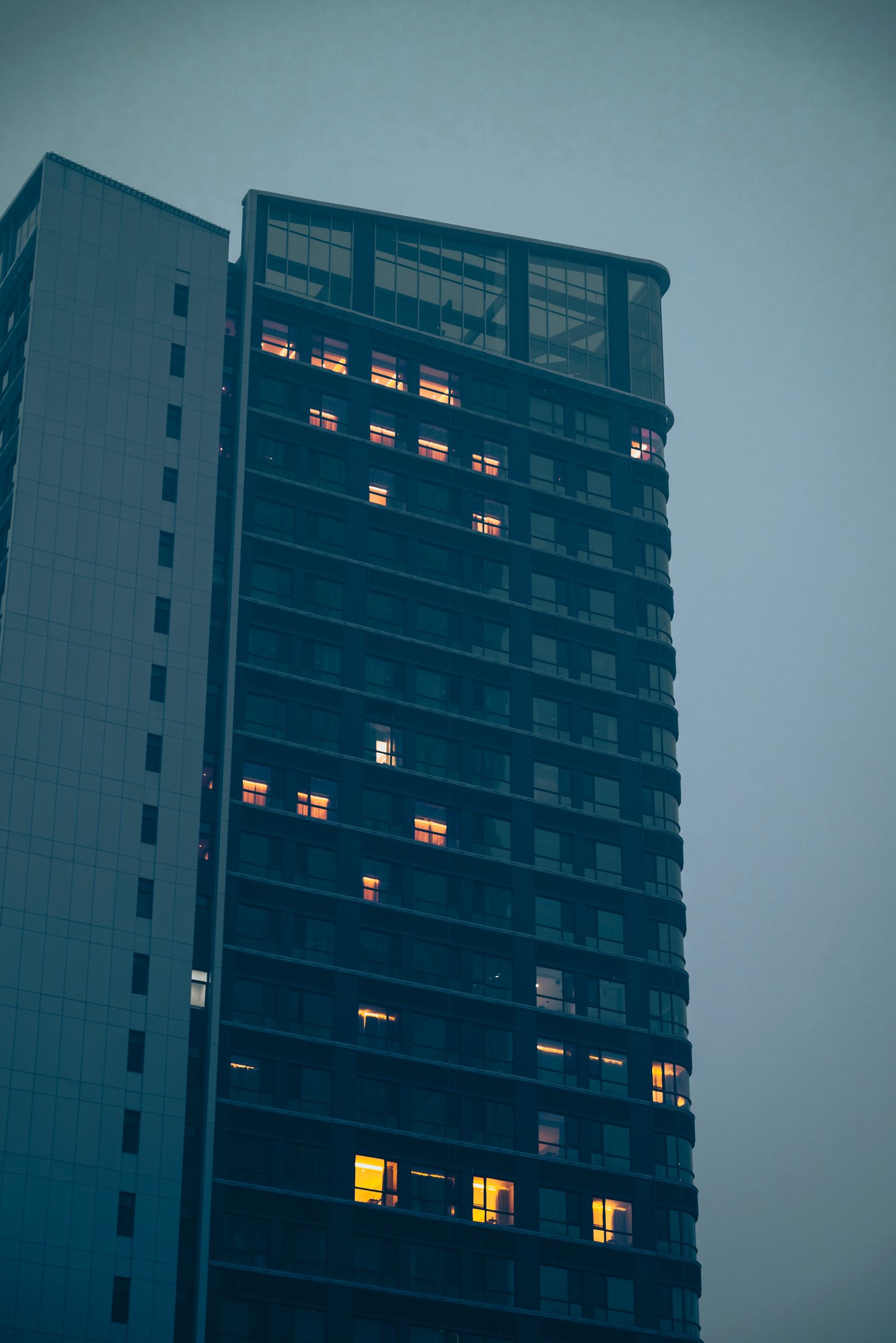 Modern high-rise building at dusk in a Belgian city